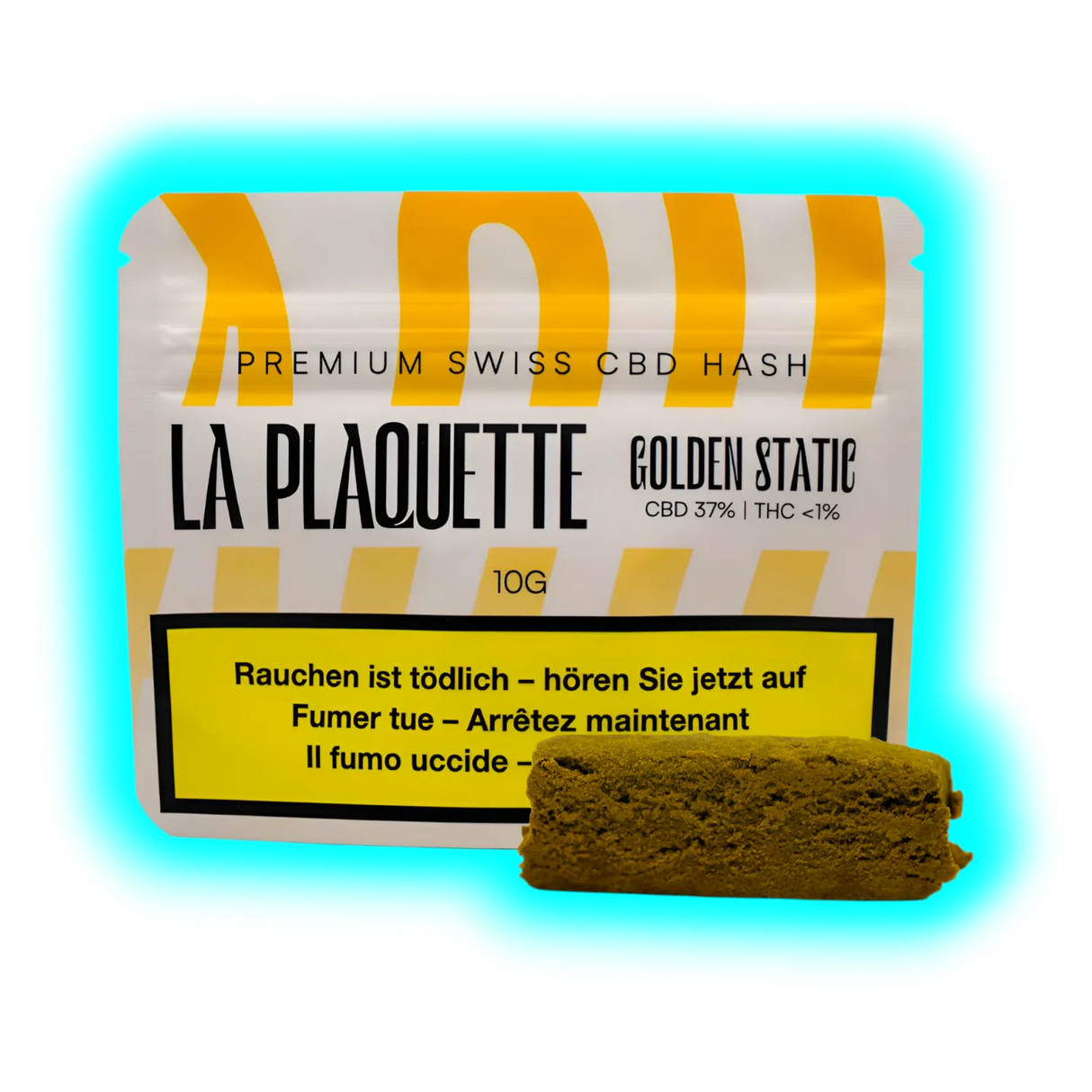 Design-Verpackung für „LA PLAQUETTE GOLDEN STATE“ mit beiliegendem braunem Hasch-Fragment.