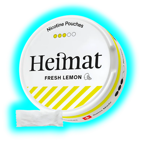 Runde Dose mit Schriftzug Heimat FRESH LEMON und gelb-weißen Designstreifen sowie danebenliegendem weißen Portionsbeutel