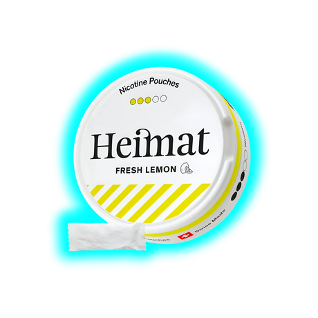 Runde Dose mit Aufschrift 'Heimat FRESH LEMON' und gelb-weißen Streifen, daneben ein weißes Päckchen mit Nikotinbeuteln