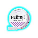 Runde Dose mit Aufschrift 'Heimat Frosty Berry' und violetten Streifen, daneben ein weißes Päckchen mit Nikotinbeuteln