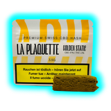Braunes Hasch-Fragment neben einer „LA PLAQUETTE GOLDEN STATE“ Box.