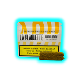 Verpackung mit der Aufschrift 'LA PLAQUETTE GOLDEN STATE' und einem Stück braunes CBD-Hasch daneben
